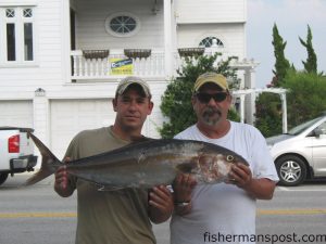 Joseph and Rison Hines with Joseph's first big fish, an amberjack he caught while jigging at Frying Pan Tower.