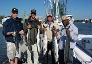 Tony McCall, Jody McCall, Ronnie Rogers, and James Coffie, all from Charlotte, NC, with king mackerel and black sea bass hooked southwest of Frying Pan Tower. They were fishing with Capt. Keith Logan of Stand N' Down Charters out of Holden Beach.
