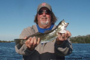 Paul Graham, from Morehead City, with a speckled trout he caught in Hancock Creek on a white Gulp bait.