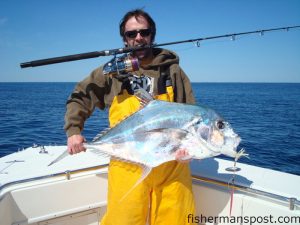 Robert Herring, of Wilmington, with an African pompano he hooked while vertical jigging some bottom structure inshore of the Steeples. Photo courtesy of Tex's Tackle.