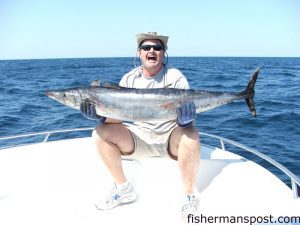 Dave Keith, of Wilmington, with a 60" wahoo he hooked while trolling off Masonboro Inlet aboard the "Chum Maker 2." The 'hoo fell for a ballyhoo under a Blue Water Candy skirt in 275' at the Same Ol'.
