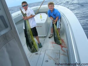 Tripp Hooks, from Ocean Isle, and Hunter Kendall, from Asheville, NC, with a pair of dolphin they hooked while trolling the Gulf Stream near the Blackjack Hole. The 'phins bit skirted ballyhoo while they were fishing with Capt. David Hooks of Capt. Hook Outdoors.