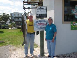 Fred Doe, of Emerald Isle's Lady Doe Fishing Team, and Martha K. Eaves, from Boone, NC, with a 38 lb. cobie they hooked on a dead pogy fished on the bottom of Beaufort Inlet. Weighed in at Chasin Tails Outdoors.