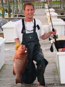 Brad Hutchens, from Apex, NC, with a red grouper he hooked on a butterfly jig 40 miles offshore of Beaufort Inlet. He was fishing aboard the "PikPocket."