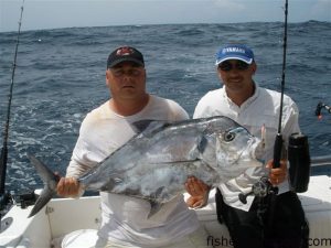 Ronnie Ensminger, from Charlotte, NC, and Capt. Keith Logan, of Stand N Down Charters out of Holden Beach, with an African pompano that fell for a Blue Water Candy Roscoe Jig near the 100/400.