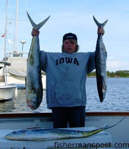 Drew Edger, of Maryland, with a dolphin and a king mackerel he caught while fishing offshore of Southport aboard the charter boat "Yeah Right II" with Capts. Butch and Chris Foster.