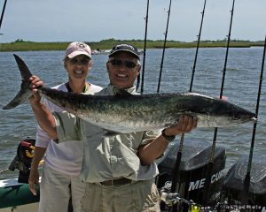 Margaret and Burt Ferebee, of New Bern's Second Catch Fishing Team, with the 33.10 lb. king mackerel that earned first place and $25,000 in the Swansboro Rotary King Mackerel Tournament. The smoker king fell for a live pogy on the downrigger near the Papoose wreck. Photo courtesy of Lew McCloud.