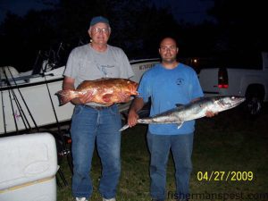 Bob Sheperd, from Kingsport, TN, and Andrew Sheperd, from Wilmington, with a red grouper and a king mackerel they caught near 23 Mile Rock in 90' of water. The red fell for a live pinfish on the bottom, and the king attacked a vertical jig.