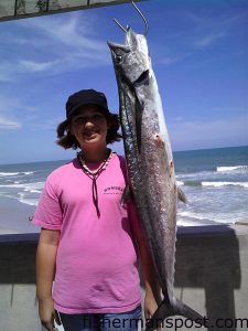 Madison Bonser (age 11) with the first king landed off Johnnie Mercer's Pier in 2009. She hooked the 19.6 lb. mackerel from the south side of the pier on a cigar minnow.