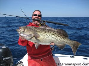 Micah Cox, of Wilmington, with a 24 lb. gag grouper he caught while jigging near the Same Ol' on a Penn 760 Slammer spinning reel.