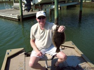 Bill Bray, of Lancaster, PA, with a flounder he hooked behind Figure Eight Island on a jighead and Gulp. He was fishing with Don Harris and John Newton.