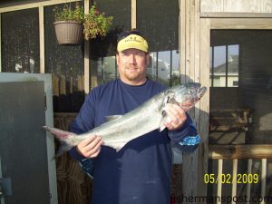 Mike Mattice with a 6.26 lb. bluefish he hooked from Surf City PIer while casting a Gotcha plug.