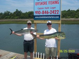 David Willis, from Fort Belvoir, WA, and Richard Jenkins, Jr., from Raleigh, with a bull dolphin adn a big king mackerel that fell for cigar minnows behind South Chatham Tackle Pirate Plugs near the Horseshoe while they were fishing with Capt. Keith Logan of Stand'N Down Charters out of Holden Beach.