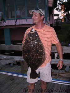 Will Palmer, of Little River, SC, with a 29.5", 10.65 lb. flounder he hooked on a live spot on 10 lb. line with a 15 lb. leader behind Capt. Juel's Hurricane Restaurant in Little River.