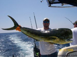 Chad Burchette, of Wilmington, with a 40 lb. dolphin that fell for a ballyhoo under a blue/orange JAG near the Same Ol'. He was fishing with Joe Currie aboard the "LeverDrag."