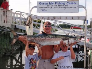 Jonah, Donnie, and Wells Ballantine, from Charlotte, NC, with a 40.7 lb. king mackerel they hooked while live-baiting in 60' of water off Ocean Isle. They were fishing with Capt. Roger Gales aboard the "Carolina Cat" out of the Ocean Isle Fishing Center.
