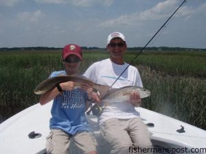 Eric and Jan McMaster, from Wisconsin, with red drum they hooked while fishing with Capt. Patrick Kelly of Capt. Smiley's Fishing Charters our of Little River. Eric's fish fell for a Gulp Alive shrimp, and Jan's took a Clouser Minnow on 7-weight fly gear.