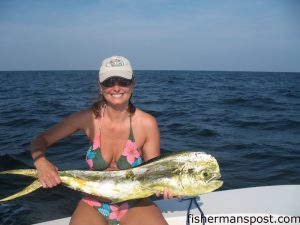 Serena Varnam Bowman, from Holden Beach, with a 25 lb. dolphin she hooked on a live bait near the Horseshoe. She was fishing with Capts. Mike Bowman and Cane Faircloth on the "Salty Fisher."