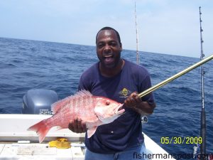 Rick Chowder, of Charlotte, NC, with an American red snapper he hooked on cut bait in 110' of water. He was fishing 32 miles off Carolina Beach with his cousin Carl Hailey and Capt. Rich Walter on the "Reelaxation."