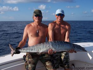 Capt. Bill Zeron and David French with a 52 lb. wahoo that fell for a skirted ballyhoo behind a planer. They were trolling the Steeples aboard the "Bottom Line."