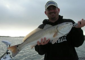 Daniel Griffee with his first topwater red drum, a 26.5", 6 lb., 8 oz. fish that struck in the marsh near Morehead City while he was fishing with Dave Bernstein.