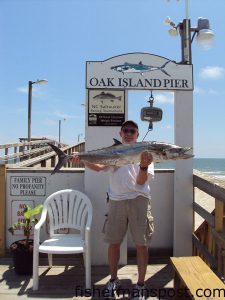 Richard Smith, from Oak Island, with a 24.4 lb. king mackerel that fell for a live bluefish pinned to a king rig off the end of Oak Island Pier.