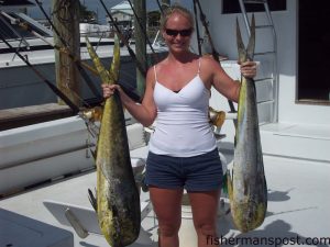 Kristy Daniels with a pair of dolphin (18 adn 21 lbs.) she hooked on ballyhoo while trolling a weedline 10 miles west of the Big Rock aboard the "Beagle" with Capt. Bill Dillon.
