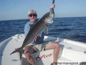 John Cooper, of Wilmington, with a 22 lb. amberjack he hooked on the fly while fishing offshore of Wrightsville Beach with Capt. Stu Caulder of Gold Leader Guide Service.