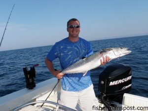 David Geist, from KS, with a 25 lb. king mackerel he hooked on a cigar minnow behind a green South Chatham Pirate Plug near Christmas Rock. 