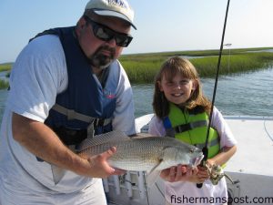Annabel Morris, from Morehead City, with a 6 lb. puppy drum she landed on ultralight gear with a cut mullet bait. She was fishing with her uncle Tom Turner.