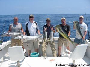 Robert Wilkie and friends from Graham, NC, with wahoo, dolphin, and blackfin tuna they hooked on trolled ballyhoo near the Blackjack Hole. They were fishing with Capt. Richard Flick aboard the charter boat "Get Reel" out of Southport.