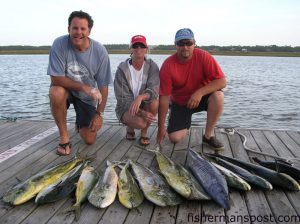 Tracy Pekkala and Henry Hare, of High Point, NC, and Capt. Chuck Truby, of Oak Island, with a catch of dolphin, a wahoo, and a blackfin tuna they hooked while trolling at the Steeples on the "Knot Reel." The fish fell for ballyhoo under Ilanders and sea witches along with a Green Machine.