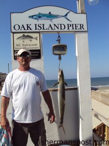 Richard Faile, of Oak Island, with an 18.5 lb. king mackerel that fell for a live bluefish on the new Oak Island Pier.