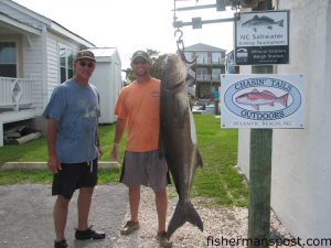 Jacob Wescole and his father, from Willow Springs, NC, with an 88 lb. cobia that fell for a dea pogy fished on the bottom of Beaufort Inlet. Weighed at Chasin Tails Outdoors.