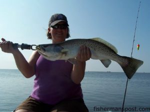 Ashely Bonner, from Greenville, NC, with a 6 lb. speckled trout she hooked on an Exude shrimp under a popping cork. She was fishing with Capt. Rennie Clark of Tournament Trail Charters during Military Appreciation Day.