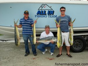 Joe Beard, of Laceys Spring, AL, and Chris Beard and Brandon Ventura, of Jacksonville, NC, with dolphin they hooked while trolling off New River inlet with Capts. Andy and Adam Powell of All In Charters.