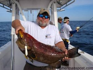 Jodie Gay, of Blue Water Candy Lures, with a 27 lb. yellowfin (fireback) grouper that fell for a 7 oz. Roscoe Jig in 180' while he was jigging with Capt. Rick Croson of Living Waters Guide Service.