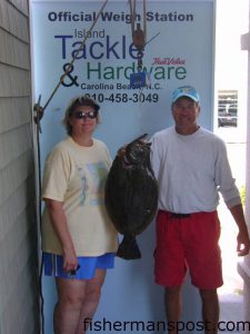 Mike and Vicki Base, of Clinton, NC, with a 9 lb., 10 oz. flounder they hooked near Carolina Beach in the ICW on a live peanut pogy and were able to land despite not having a net. Weighed at Island Tackle.