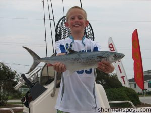 Noah Moretz (age 9), from Raleigh, with his first spanish mackerel. A trolled Clarkspoon fooled the fish while he was fishing with his father in Beaufort Inlet. Photo courtesy of Chasin Tails Outdoors.