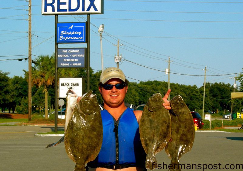 Daniel Parks Reddick, of Redix in Wrightsville Beach, with flounder he hooked while fishing from the south jetty at Masonboro Inlet with Gulp shrimp.