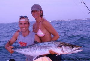 Andy and Carrie Bean, from Evansville, IN, with a stout king mackerel that fell for a live pogy while they were fishing with Capt. Philip Thompson of AUI Charters off Wrightsville Beach.