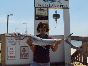 Shelby Kotler-Ross, of Charlotte, NC, with her first king mackerel. A live bluefish on a king rig fooled the fish at Oak Island Pier.