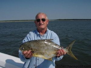 Randy Rivers, from Chesterfield, SC, with a 6 lb. pompano he hooked on a live shrimp while fishing in Little River Inlet with Capt. Patrick Kelly of Capt. Smiley's Fishing Charters.