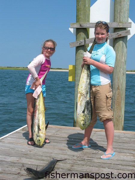Payton and Addison Casey, from Wilmington, with a pair of dolphin they hooked 20 miles off Carolina Beach while fishing with their parents and Capt. Brent Stanley of Current Adventure Charters.