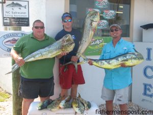 Leigh, Alex, and John, from Morehead City, with gaffer dolphin they hooked on sea witches and ballyhoo between the 14 Buoy and the 90' Drop. Photo courtesy of Chasin Tails Outdoors.
