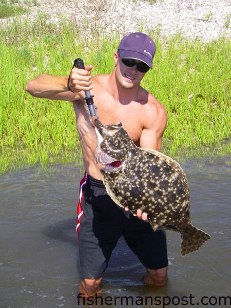 Ryan Hunnicut, of Wilmington, with an 8 lb. flounder he hooked and landed without a net while fishing with Chris Primm inshore of Wrightsville Beach. The doormat fell for a large live pogy.