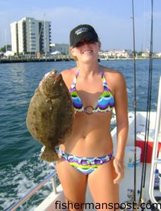 Katlyn Wood, from Clayton, NC, with a 22" flounder that was the second fish she's ever caught. She hooked the flattie on a live pogy while fishing with her stepdad near Atlantic Beach.