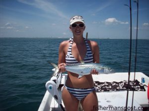 Ashely Noe, a bartender at Atlantic Beach's Beach Tavern, with a large spanish mackerel she hooked while fishing around bait balls outside Beaufort Inlet with Capt. Dave Dietzler of Cape Lookout Charters.