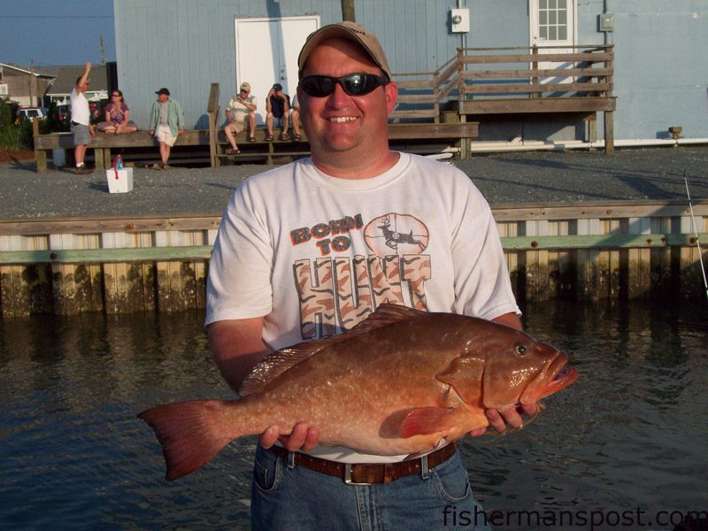 Jason, from Sioux Falls, SD, with a red grouper he hooked on a cigar minnow while fishing 40 miles off Topsail on the headboat “Vonda Kay” with Capt. Dave Gardner.