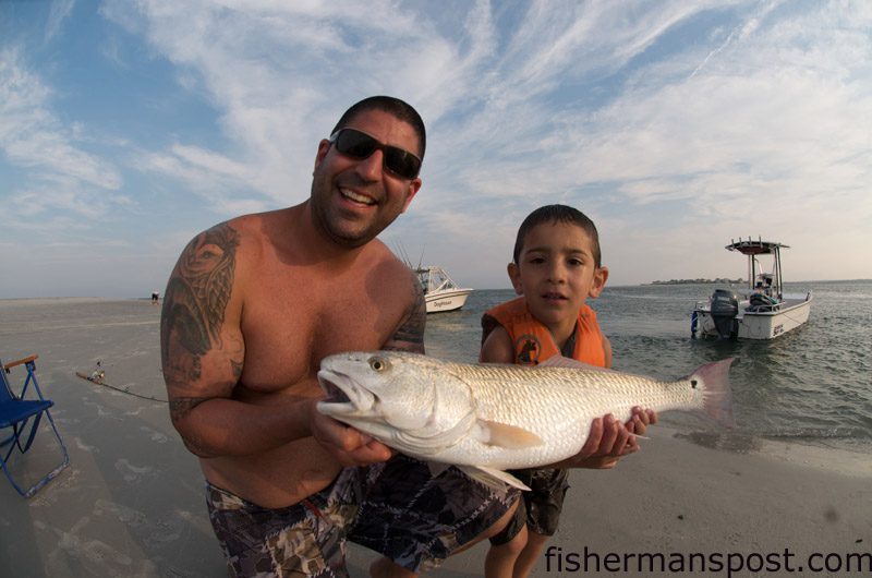 Josh Botbol, from Wilmington, with a red caught in the surf from Lea Island using a Gulp shrimp. He was fishing with his son, Mason.